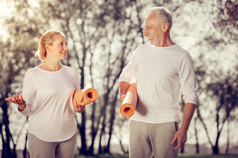 People with yoga mats getting ready to address knee pain through biomechanical intervention